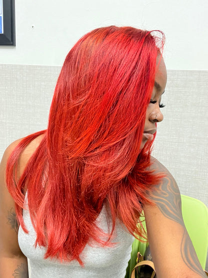 Raw SEA Curly custom-colored red and straightened to demonstrate styling versatility