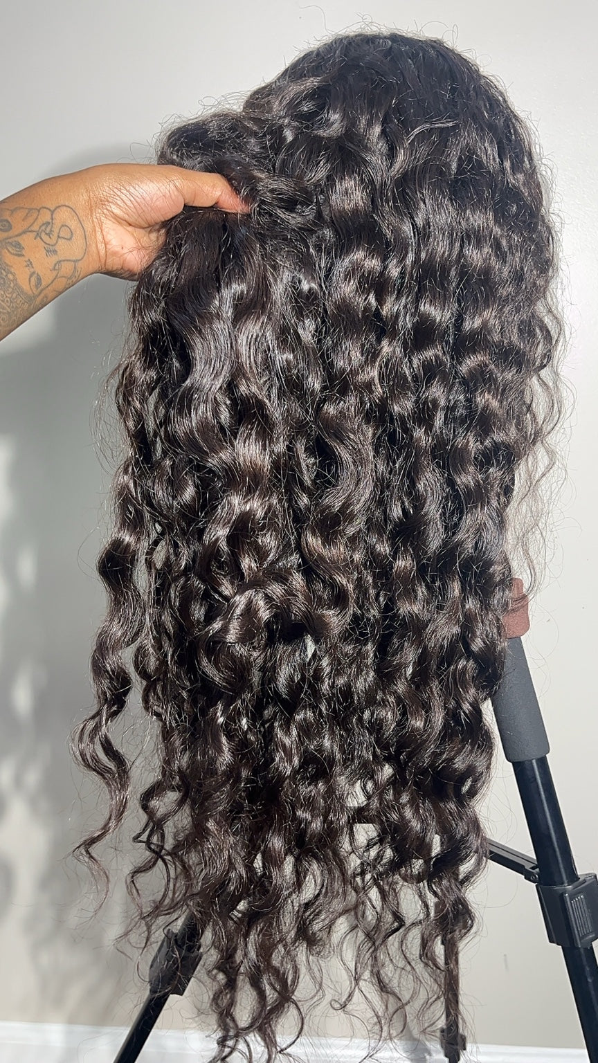 Raw SEA Curly hair showing its natural curl pattern, shine and density