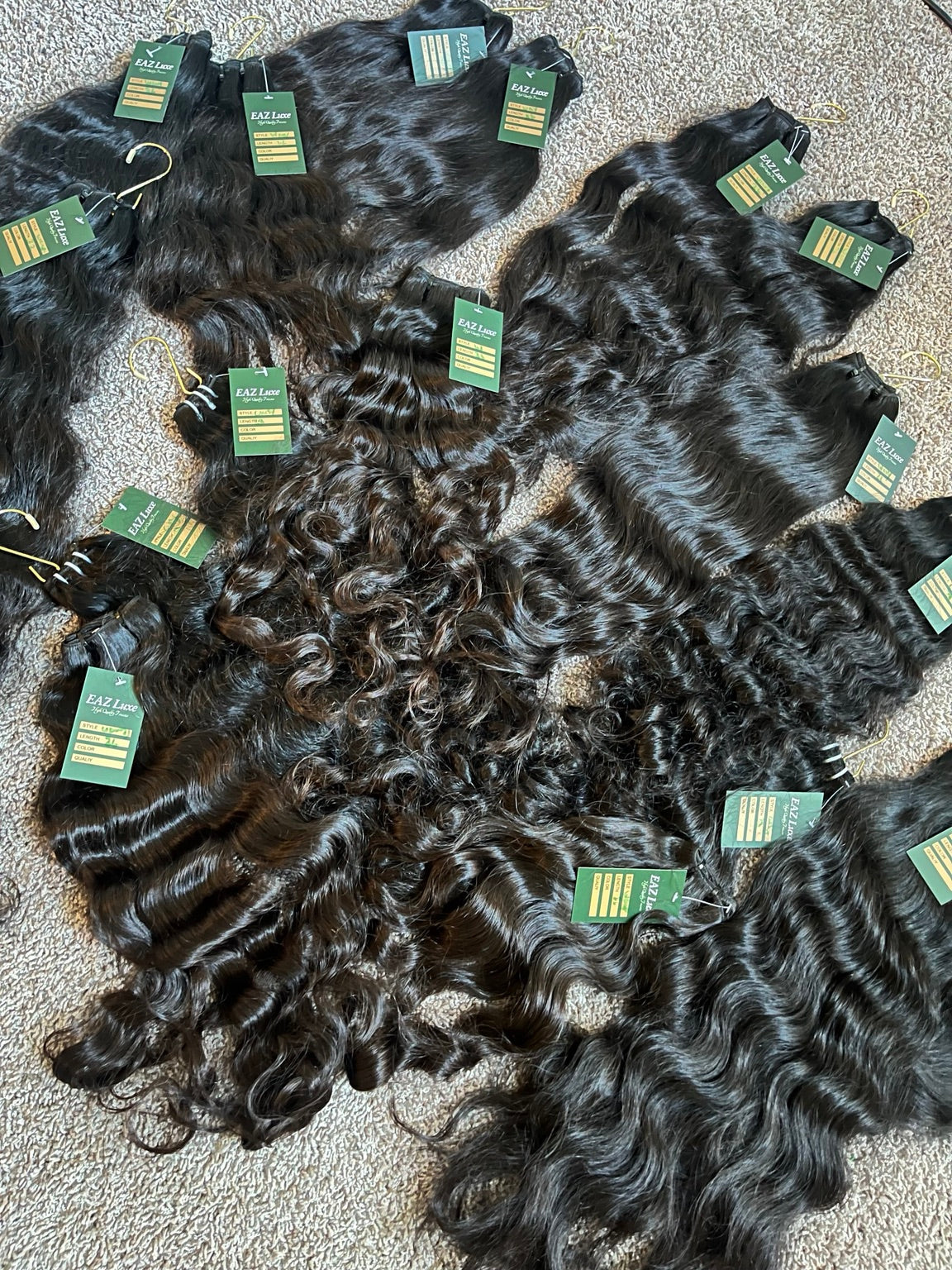 Raw SEA Straight, Wavy and Curly bundles displayed together for The Raw SEA Lookbook by EAZ Luxe
