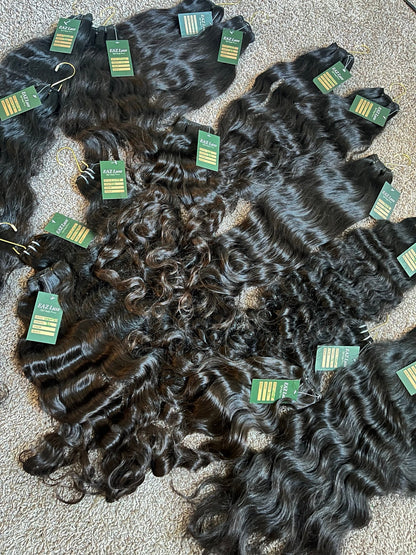 Raw SEA Straight, Wavy and Curly bundles displayed together for The Raw SEA Lookbook by EAZ Luxe